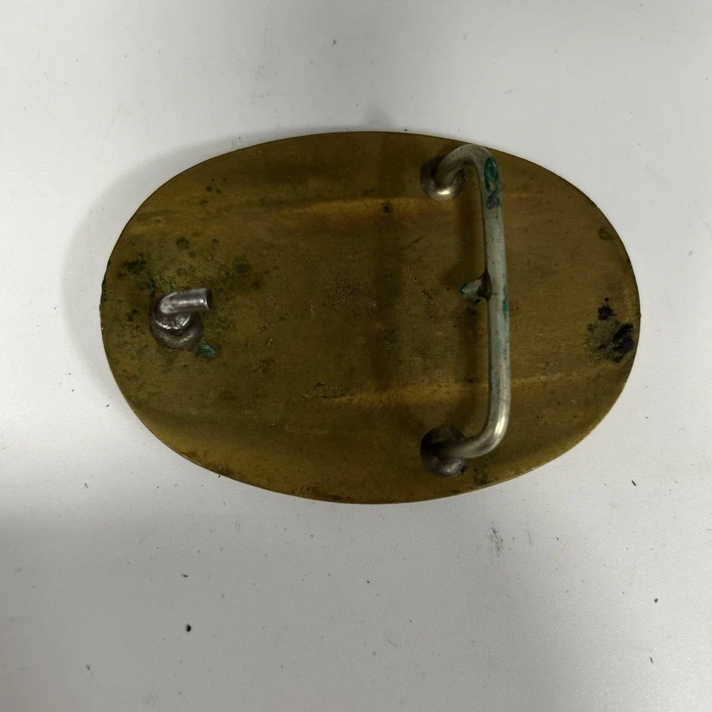 belt buckle appears to be a vintage Silver Finish / Brass